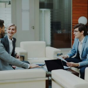 Banking professionals reviewing financial reports for Tompkins Financial