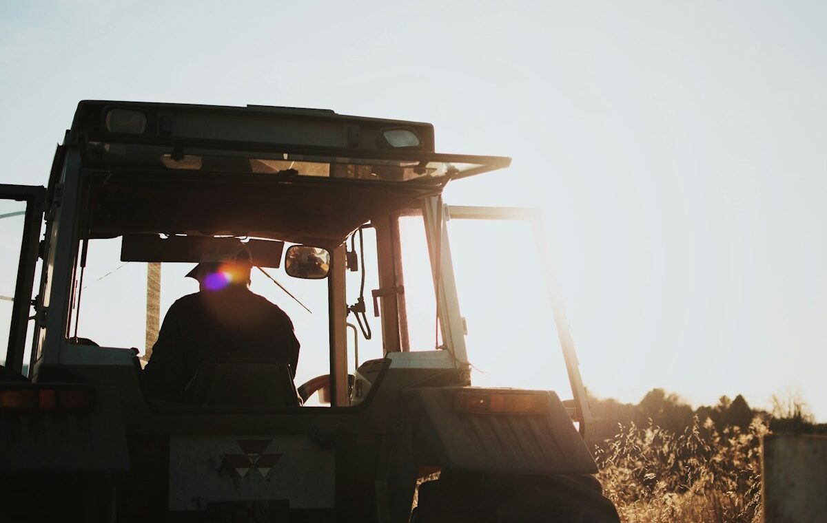 Farmer operating a tractor as USDA and NASA modernize agricultural data