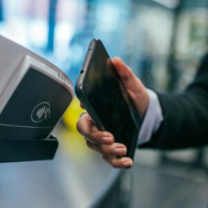 Contactless card payment at a terminal illustrating Visa stablecoin business payment adoption