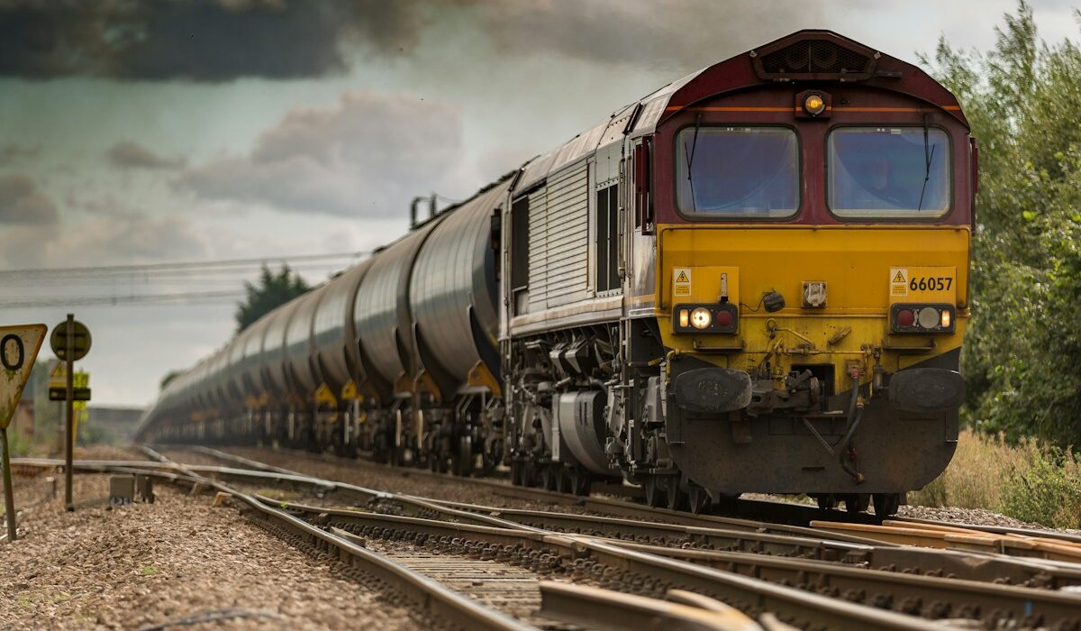 Freight locomotive on railway tracks representing Wabtec sales and rail backlog growth